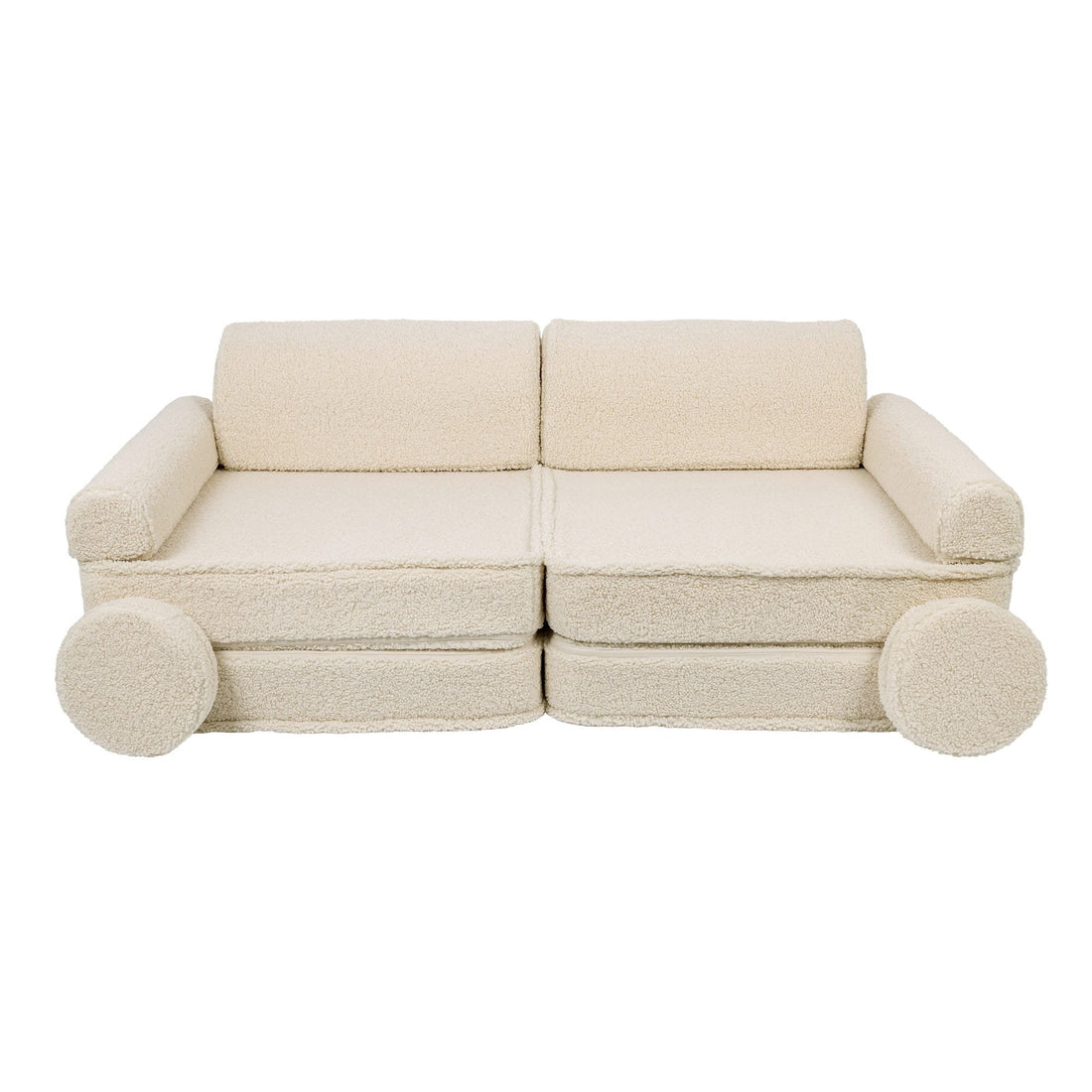 1. Cream modular children's sofa with rounded armrests and circular cushions, shown in a studio setting