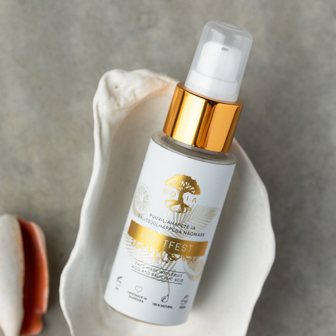 1. HOIA homespa Fruitfest Face Mask with fruit acids, shown in a shell setting, 50ml bottle