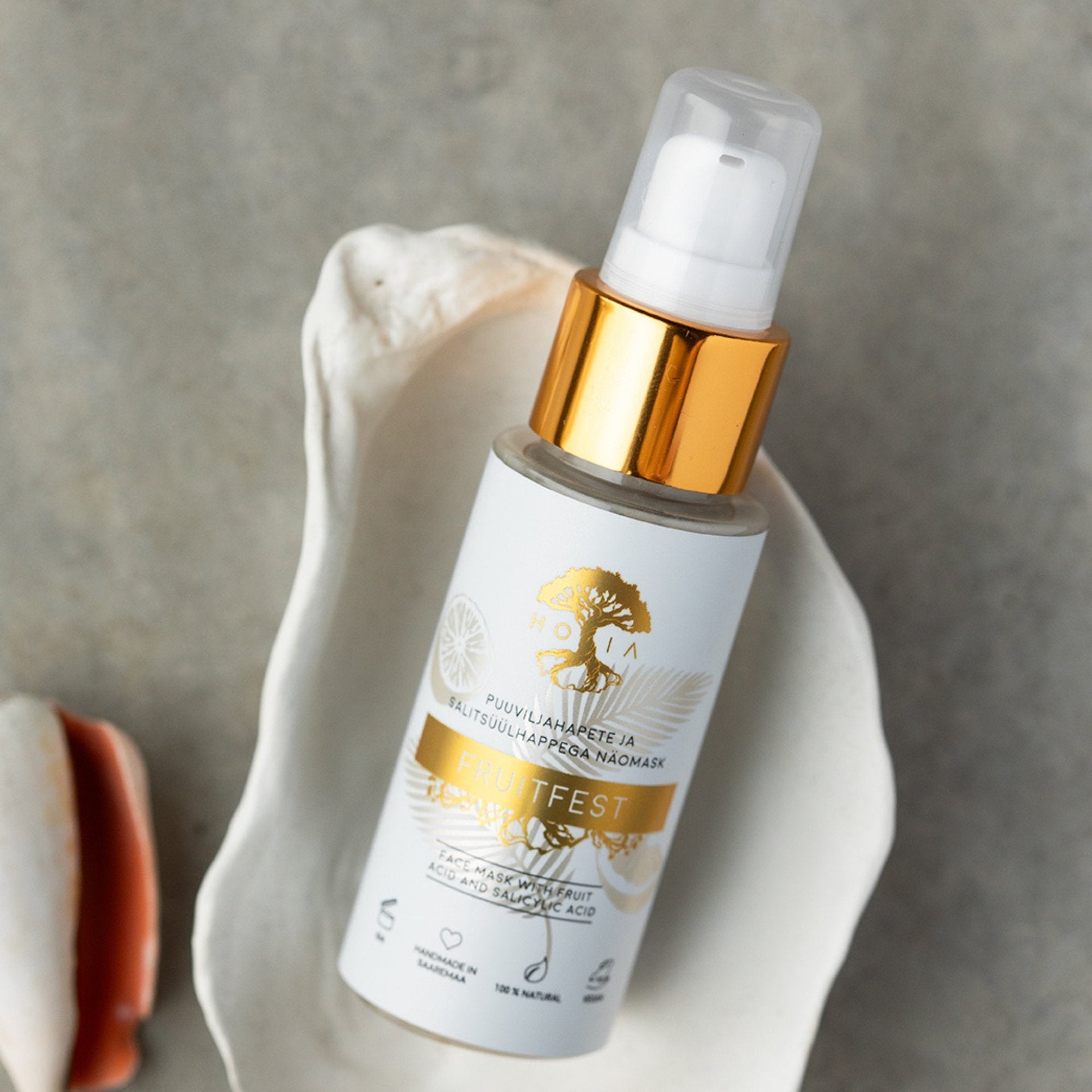 1. HOIA homespa Fruitfest Face Mask with fruit acids, shown in a shell setting, 50ml bottle
