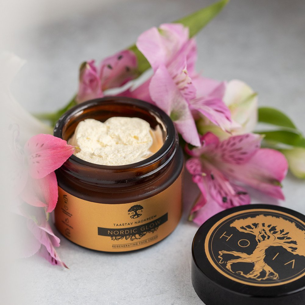 1. HOIA homespa Nordic Glow face cream in open jar with pink flowers, highlighting natural ingredients
