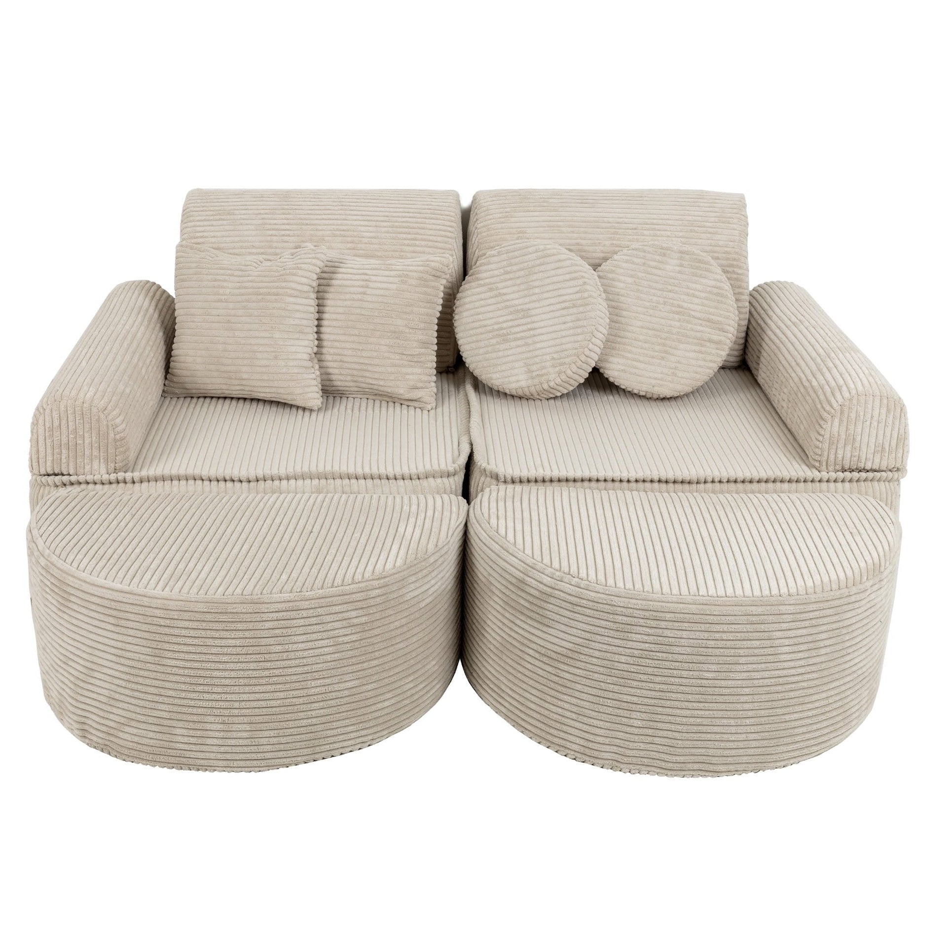 1. Modular children's sofa in aesthetic ecru with ribbed texture, featuring two seats, armrests, and multiple cushions, shown in a studio setting.
