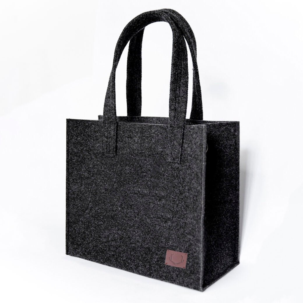 1. Unisex black Office Bag Holm by Nordhale in studio setting, showcasing minimalist design and recycled PET felt material