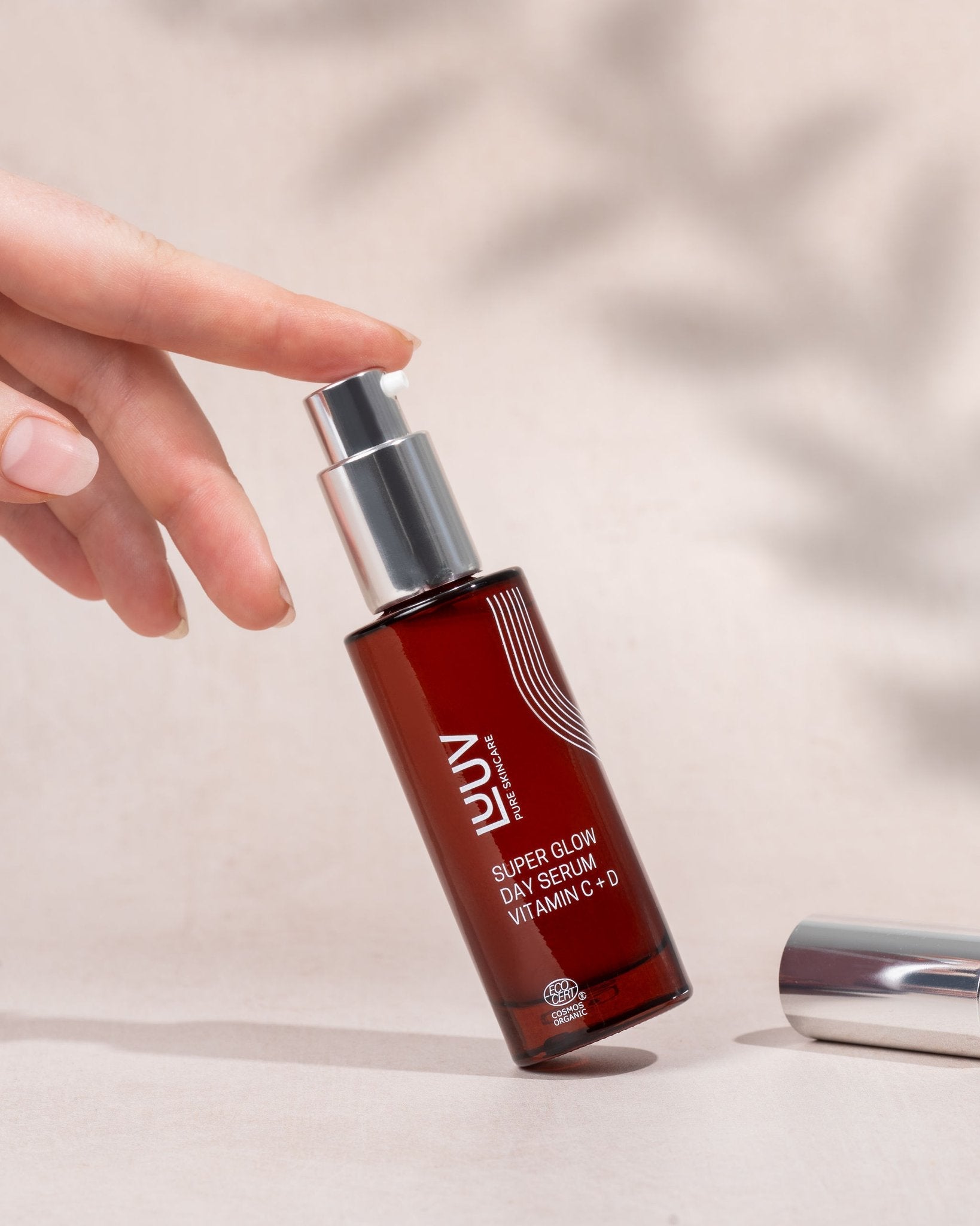 1. LUUV Super Glow Day Serum Vitamin C + D in hand, showcasing sleek bottle design