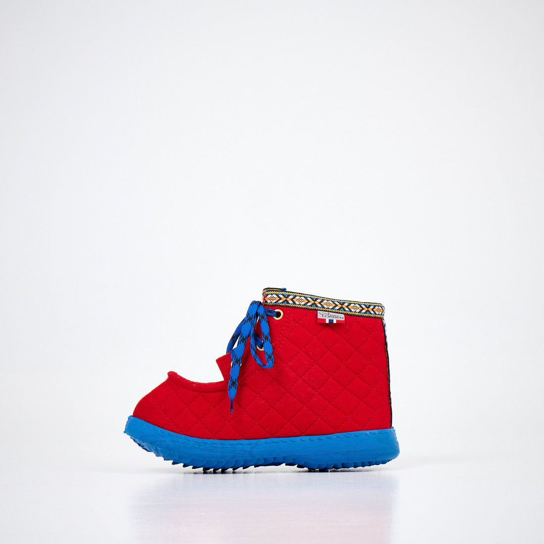 1. Studio shot of Nesna Lobben red felt boots with blue soles, featuring decorative trim and laces
