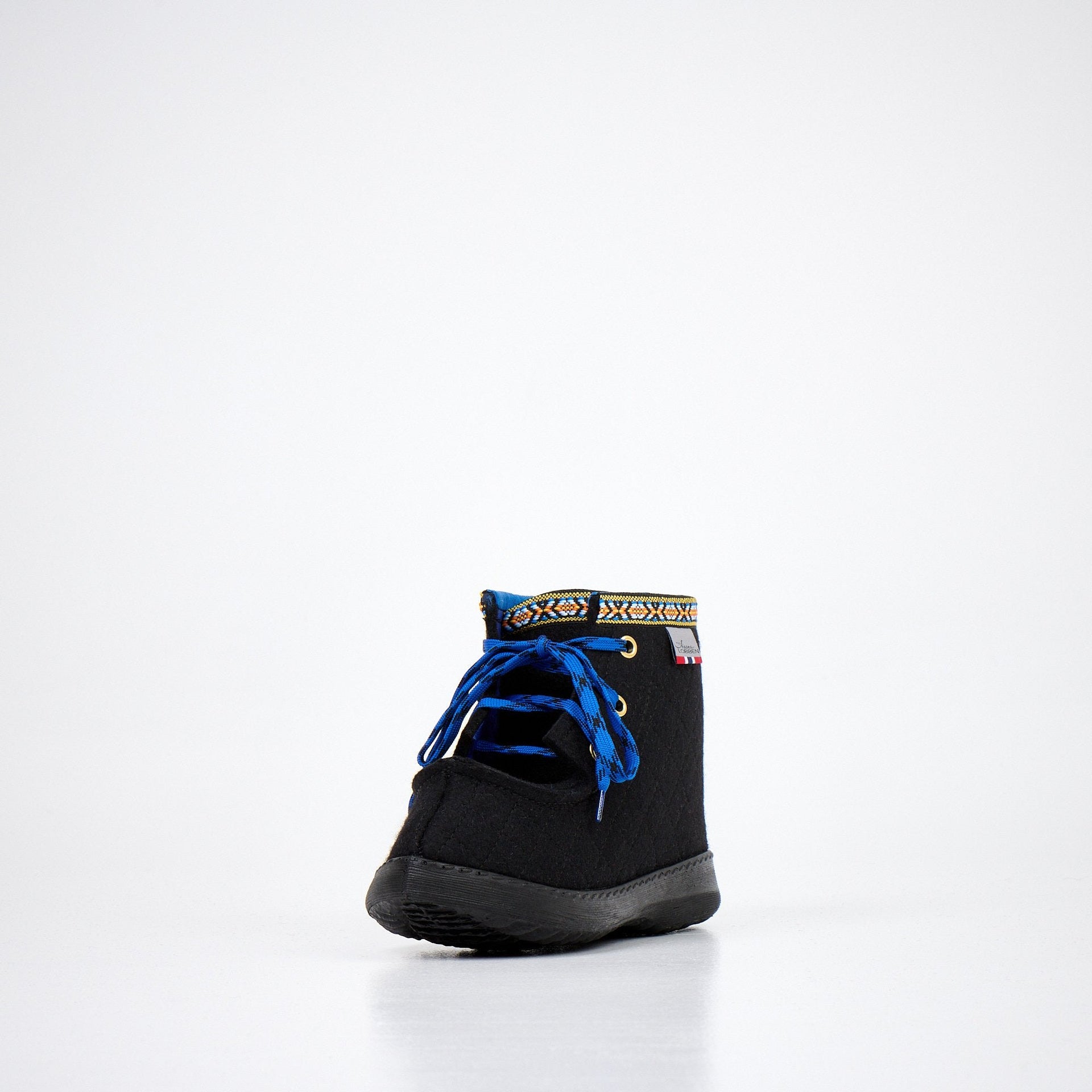 1. Studio side view of Nesna Lobben black felt boots with blue laces and patterned trim, showcasing polyurethane sole