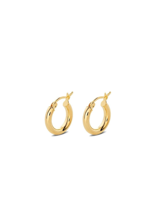1. Woman wearing SCULP Banana Love earrings with playful design, shown in lifestyle setting