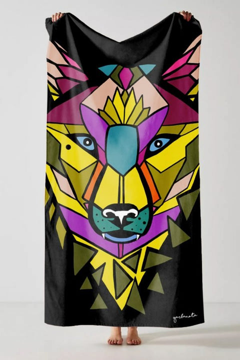 2. Studio shot of Garbanota Towel Colored Wolf in black featuring colorful geometric wolf pattern
