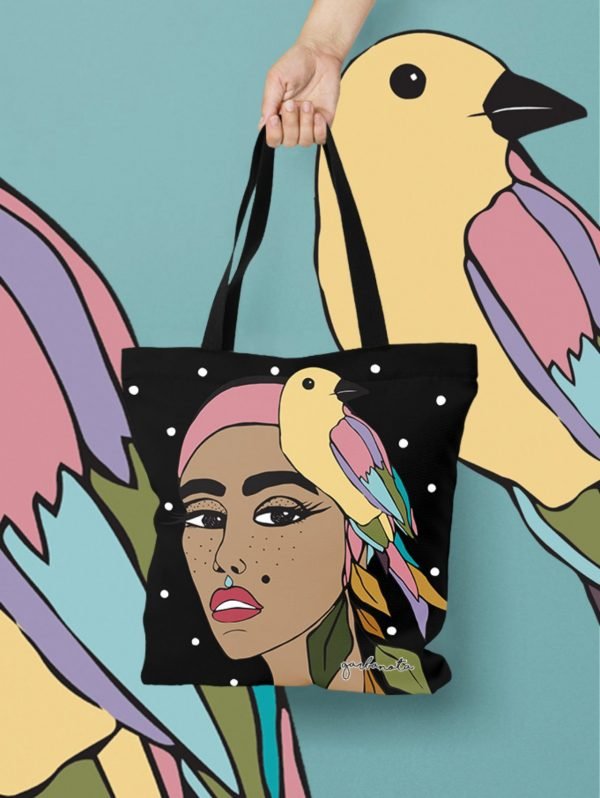 3. Black HANDBAG SIUZANA by Garbanota with colorful artistic print, shown against matching background