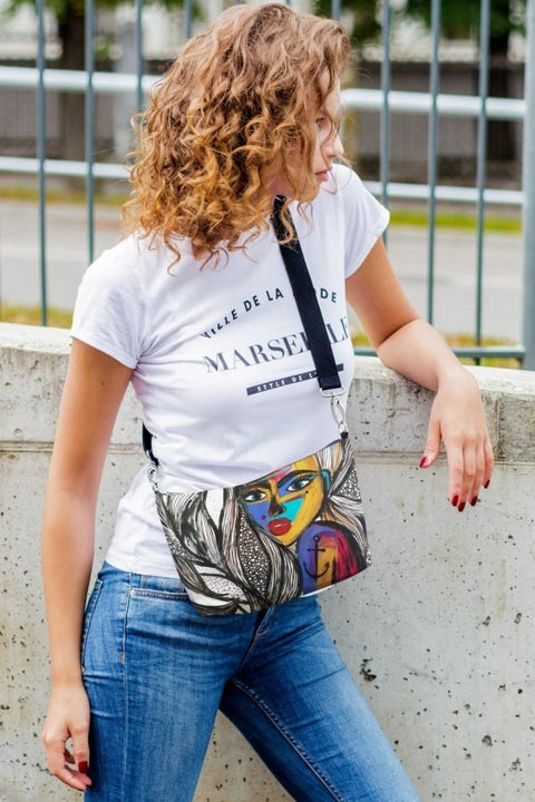 4. Women's shoulder bag with mermaid artwork by Dovilė Aleksonė, shown open with hand accessing interior