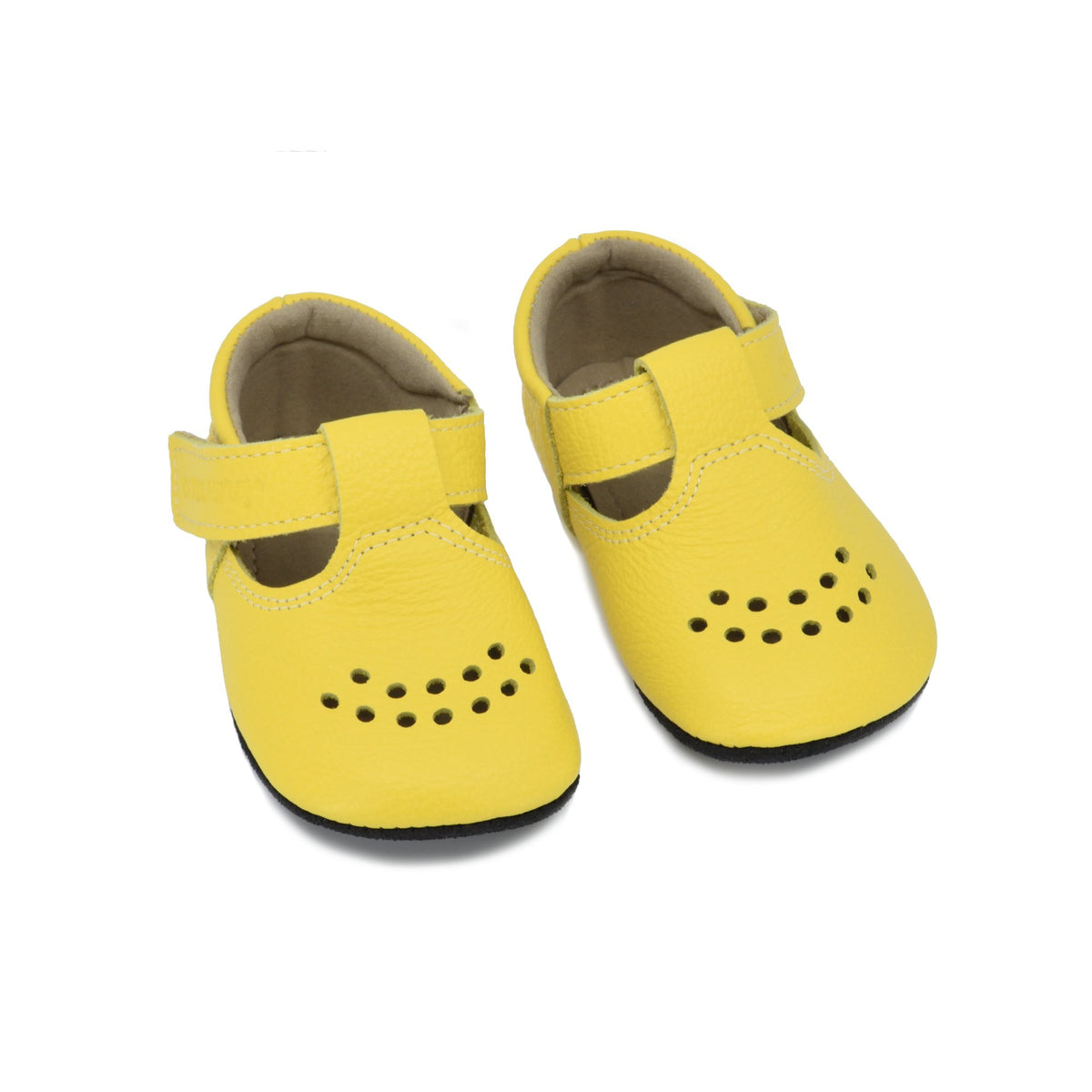2. Pair of Omaking kids' Mutsu slippers in bright yellow with perforated design and Velcro strap, shown in studio