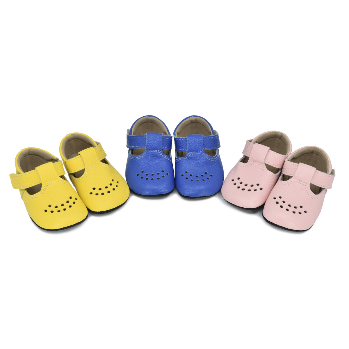 3. Trio of kids' Mutsu slippers by OmaKing in electric blue, yellow, and pink, displayed in studio