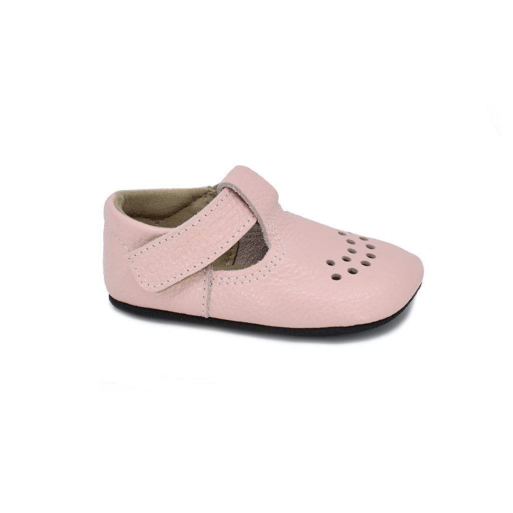 1. Kids' light pink Mutsu slipper by Omaking, featuring extra soft leather upper and adjustable Velcro fastener, shown in studio
