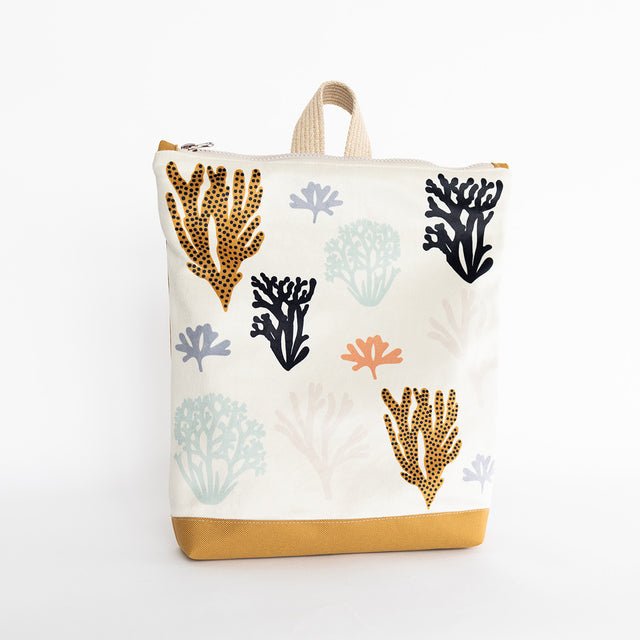 3. Studio image of Muni Corals backpack for kids, highlighting coral design and yellow polyester bottom