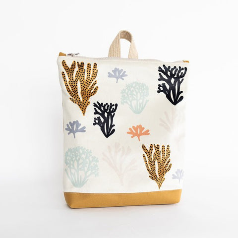 3. Studio image of Muni Corals backpack for kids, highlighting coral design and yellow polyester bottom