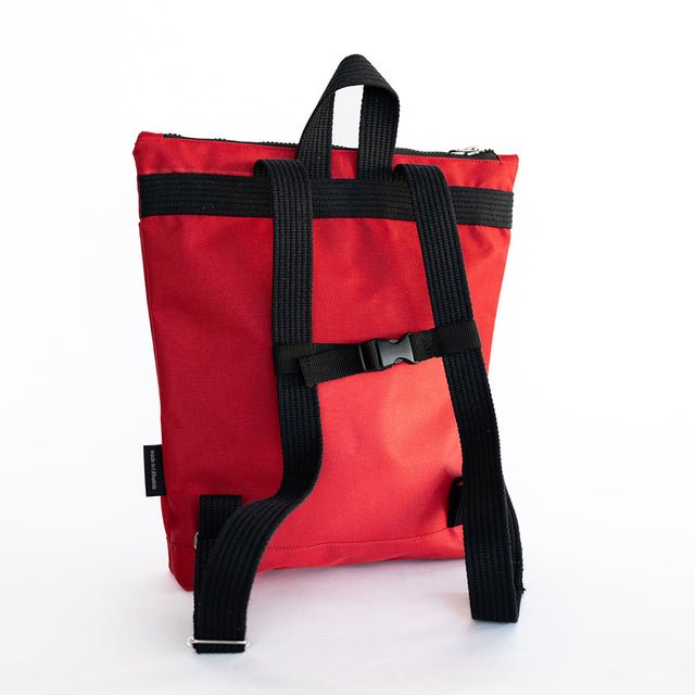 5. Back view of Muni red bow kids backpack with adjustable straps