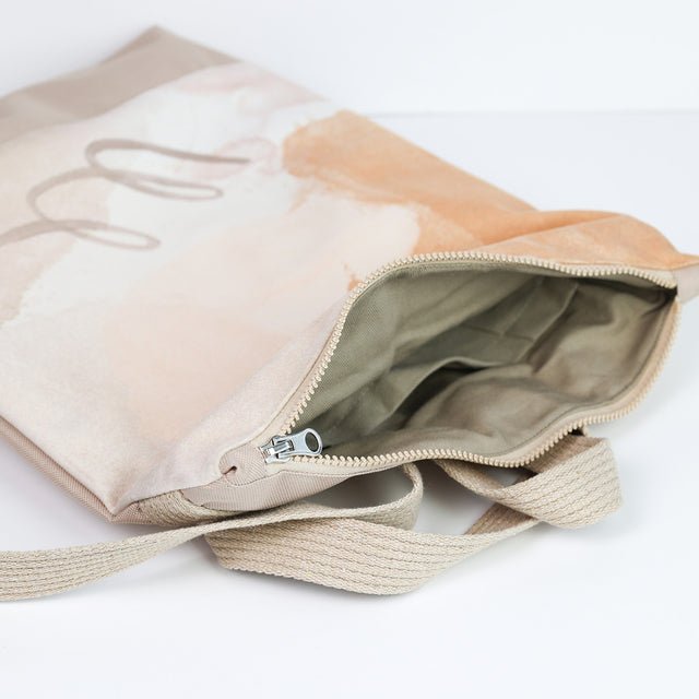 9. Interior view of Muni Abstract Beige backpack showing cotton lining and zipper closure