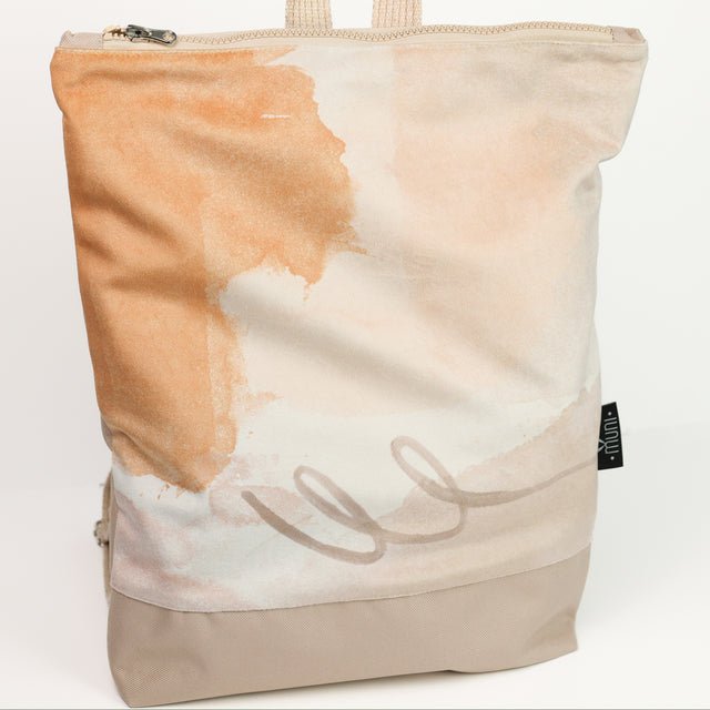 7. Studio shot of Muni Abstract Beige backpack with velvet and polyester design, front view