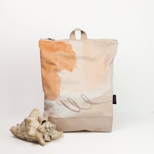 4. Muni Abstract Beige backpack with velvet and polyester design, styled with seashells, studio shot