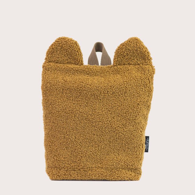 4. Studio image of Muni brown teddy backpack, featuring bear ears and recycled polyester material