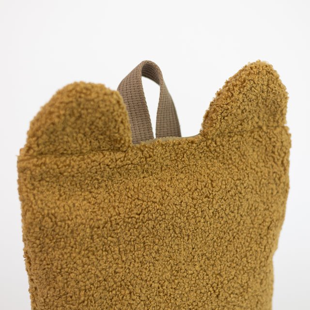 5. Close-up of Muni brown teddy backpack, highlighting soft texture and bear ear design
