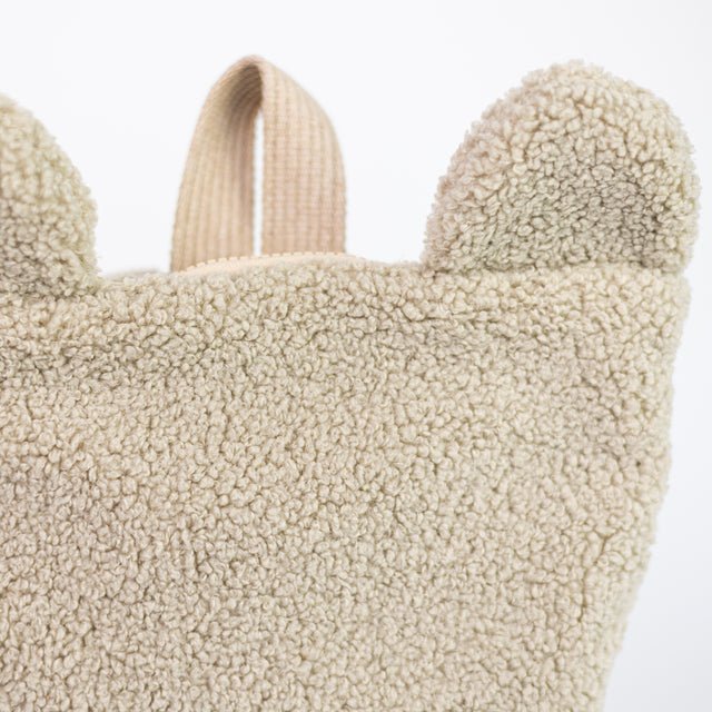 7. Close-up of bear ears on Muni beige teddy backpack, showing texture