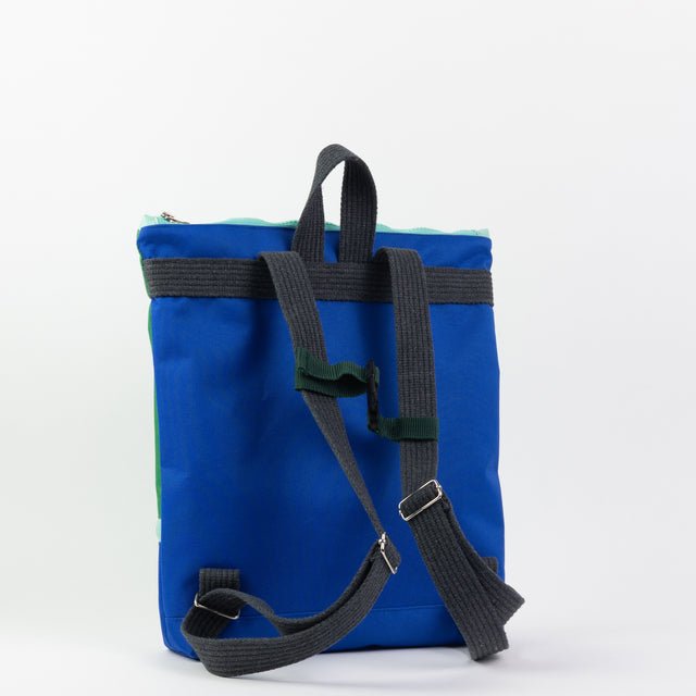 4. Back view of Muni waterproof kids backpack in blue, showing adjustable straps