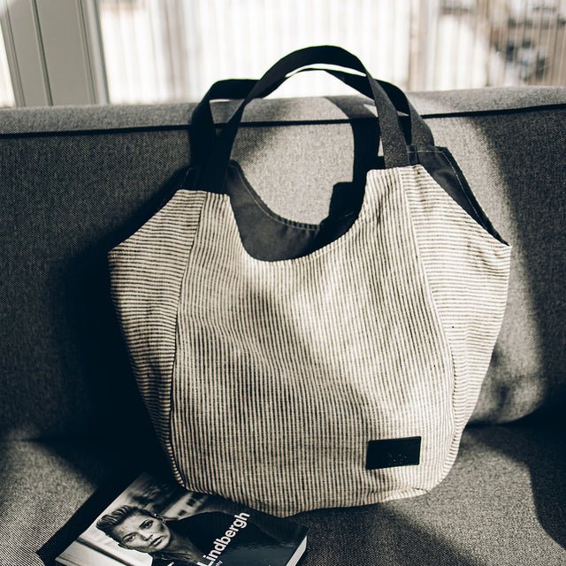 7. Close-up of Muni striped linen tote bag on a sofa
