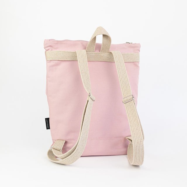 7. Back view of Muni Pink Bow backpack, showing adjustable beige straps