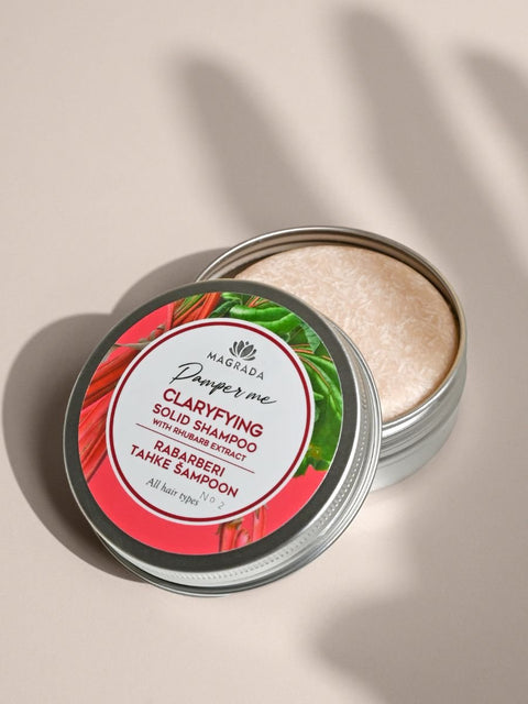 1. Magrada Organic Cosmetics Clarifying Solid Shampoo with rhubarb extract in open tin, showing textured surface