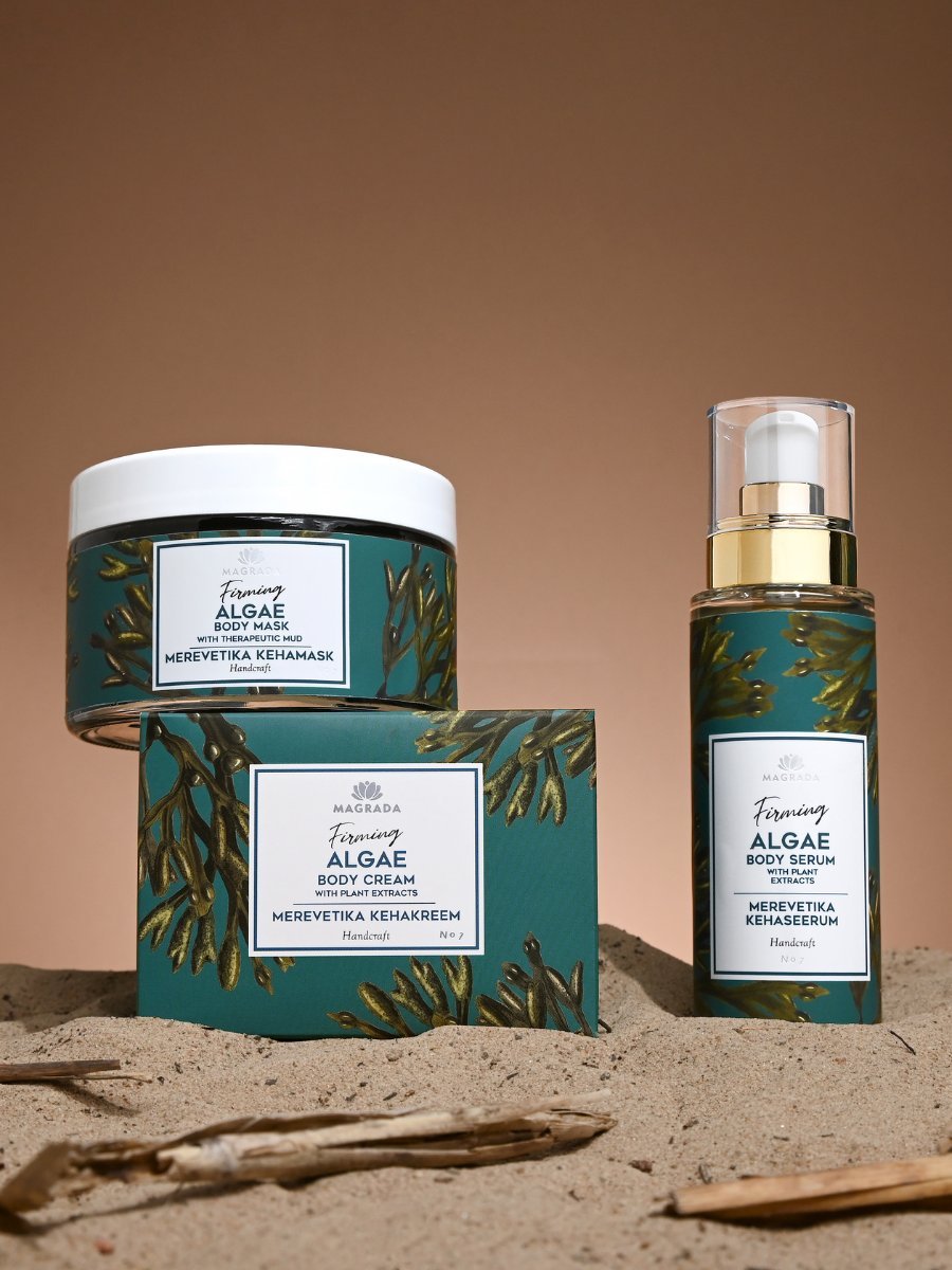 2. Magrada Organic Cosmetics Firming Algae Body Serum bottle and packaging on sand, highlighting design