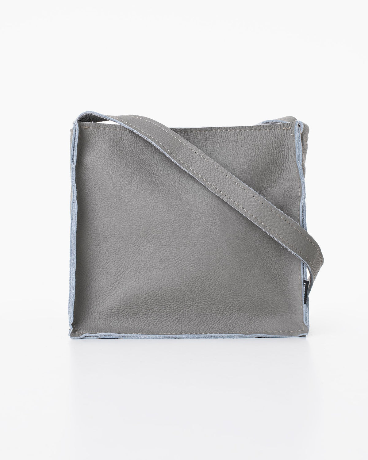 3. Studio image of light grey Folk 1 shoulder bag by Trendbag, showing front view and leather texture