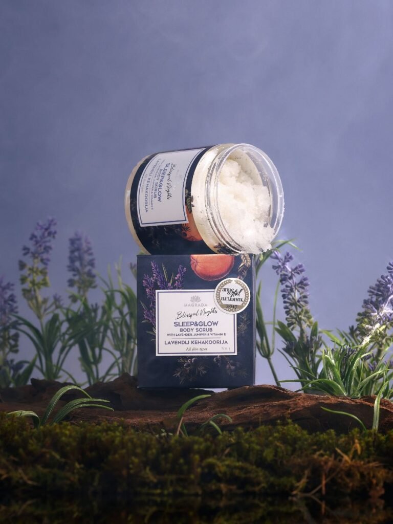 2. Magrada Organic Cosmetics Lavender Body Scrub with Grapefruit Essential Oil jar on natural setting with lavender plants