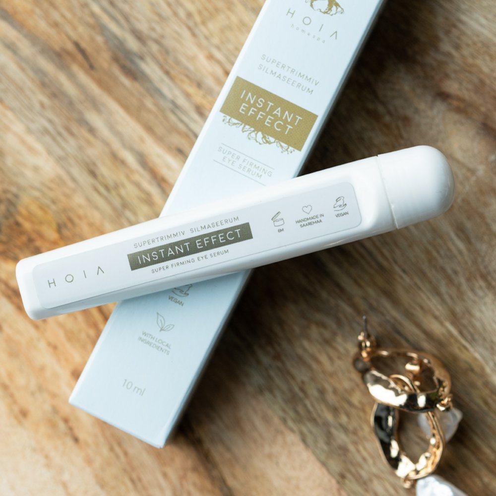 4. HOIA homespa Superfirming Eye Serum Instant Effect 10ml with box on wooden surface