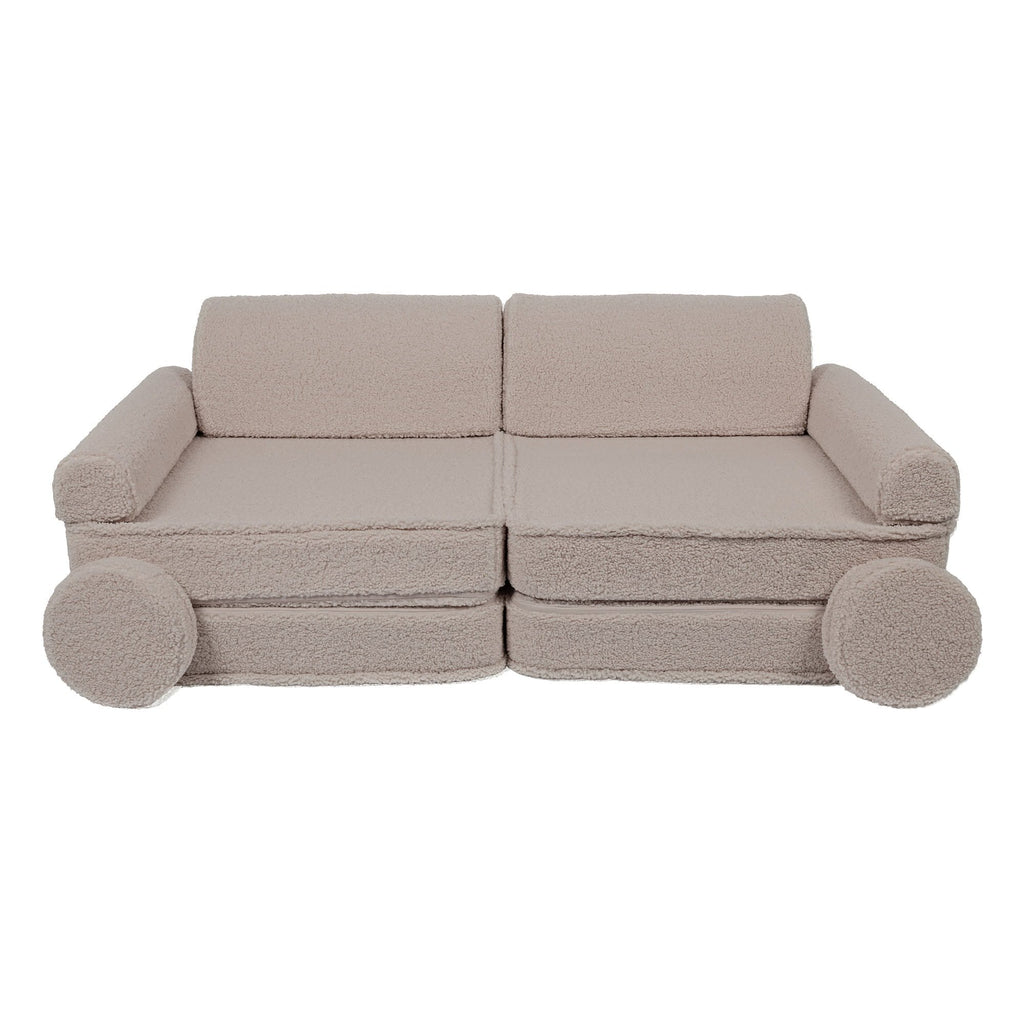 1. Large modular children's sofa in light grey with rounded armrests and circular cushions, shown in a studio setting