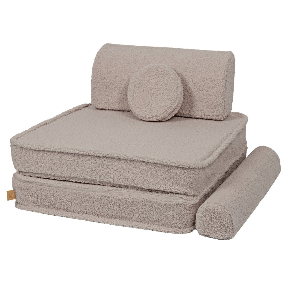 2. Light grey modular sofa piece with backrest and circular cushion, displayed in a studio