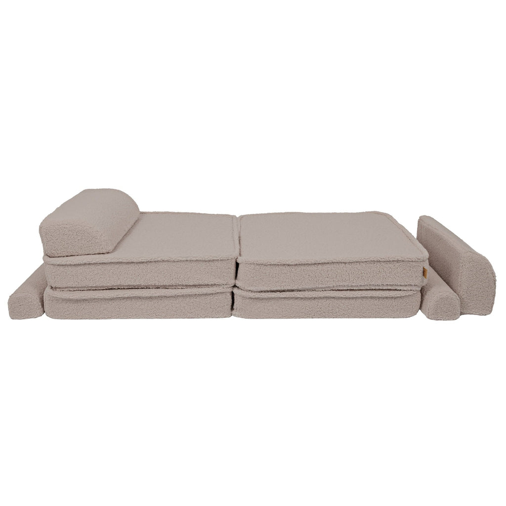 4. Light grey modular sofa pieces arranged as a flat bed with a backrest, showing versatility