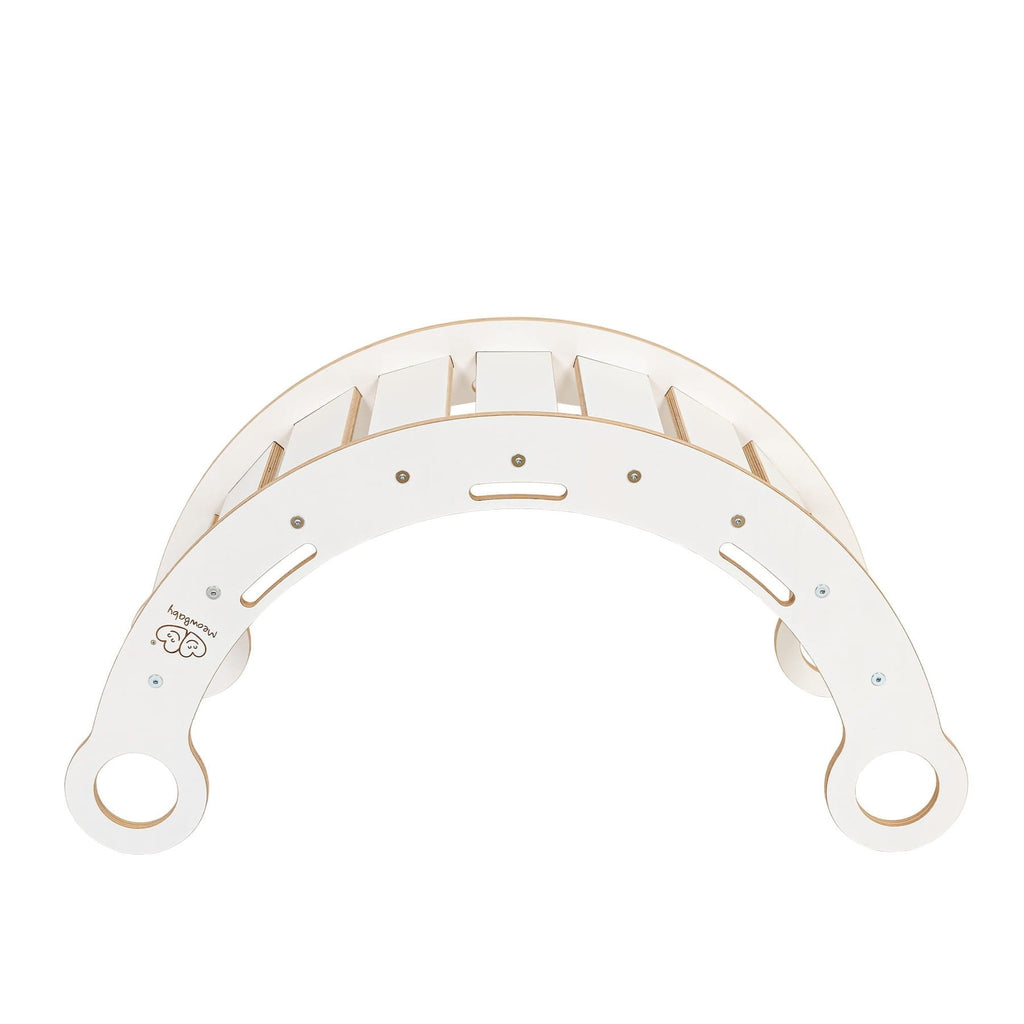 3. Side view of white wooden dream rocker, showing curved design and circular handles