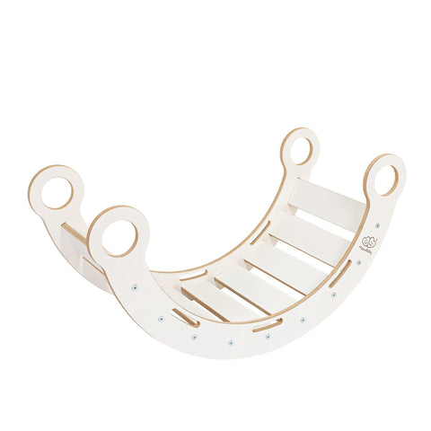 2. White wooden dream rocker with circular handles and slatted base in studio setting