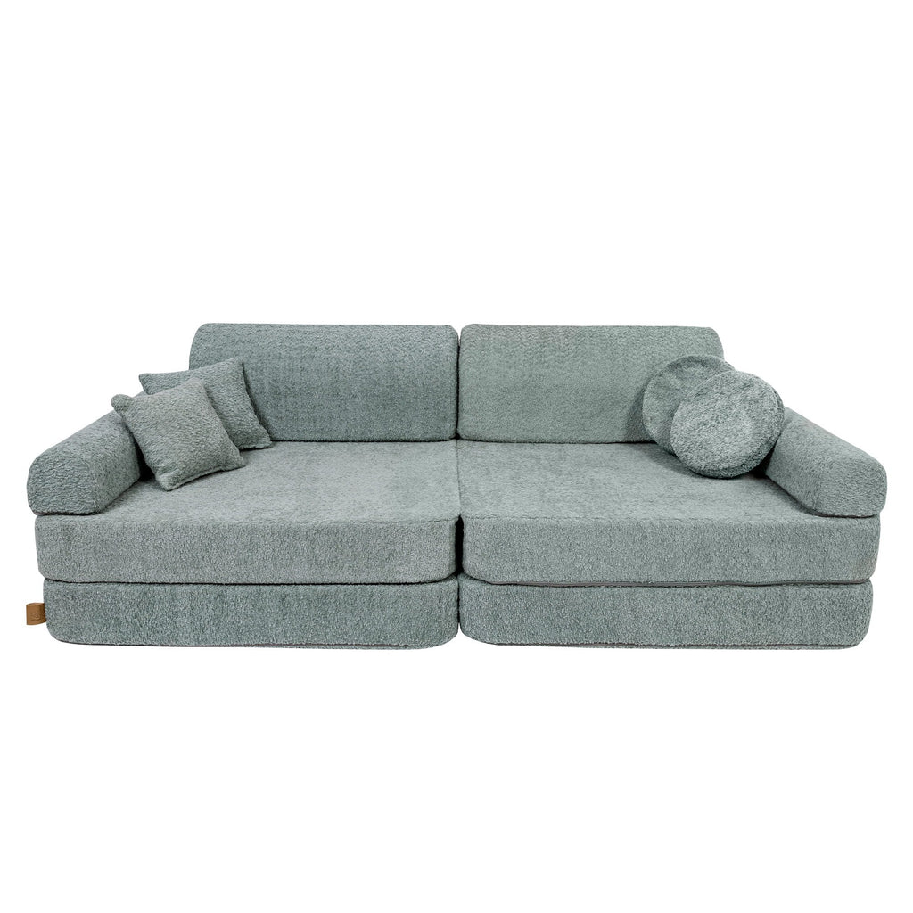 1. Large modular children's sofa in fresh mint boucle fabric with two square and one round cushion, shown in a studio setting