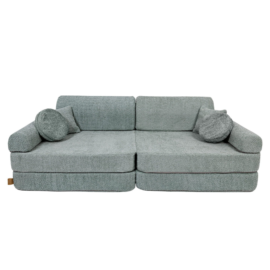 2. Large modular children's sofa in fresh mint boucle fabric with two square and one round cushion, shown in a studio setting