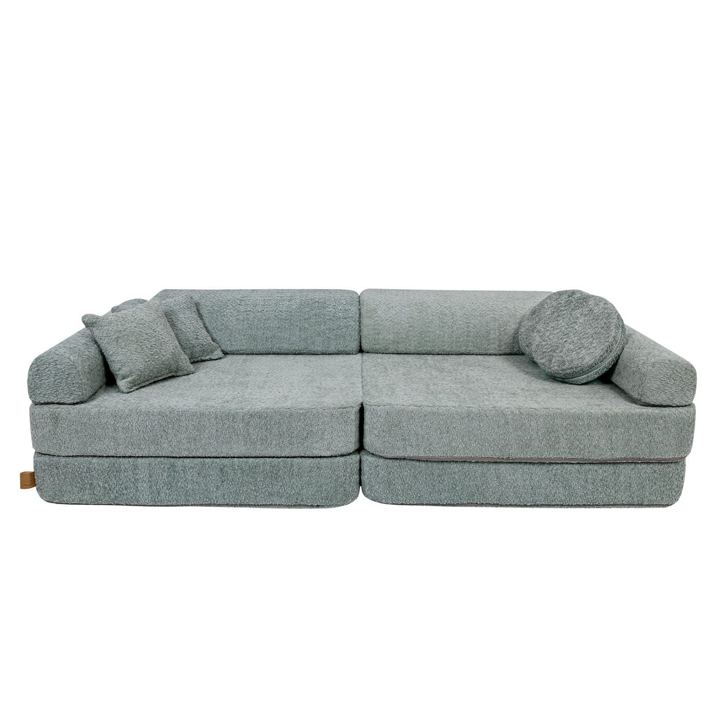 2. Large modular children's sofa in fresh mint boucle fabric with two square and one round cushion, shown in a studio setting