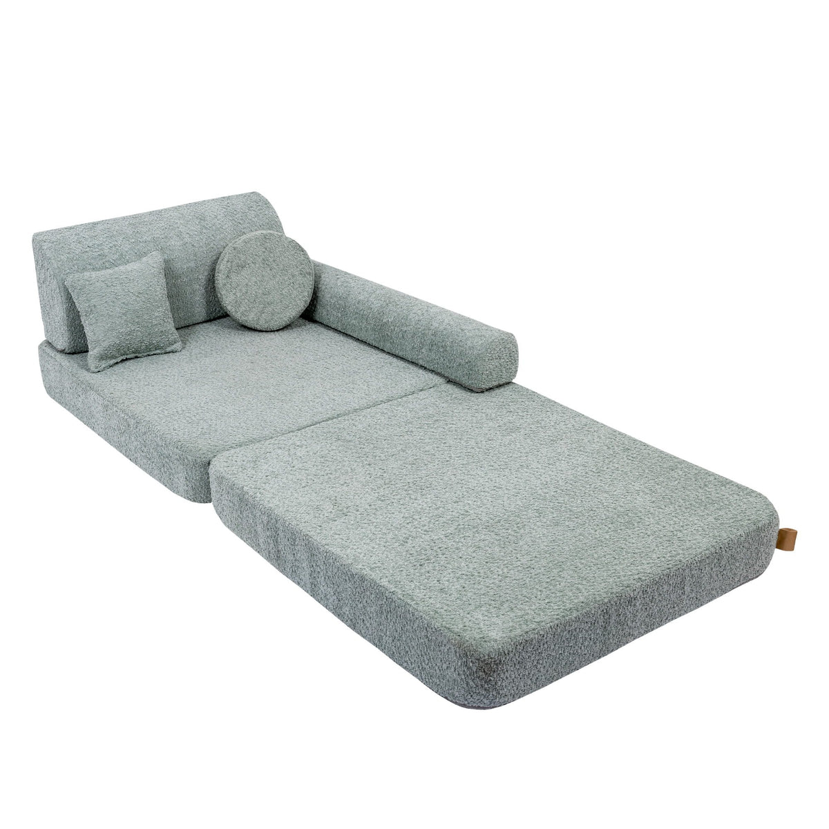 2. Modular children's sofa in fresh mint boucle fabric, extended into a lounge position with cushions, shown in a studio setting