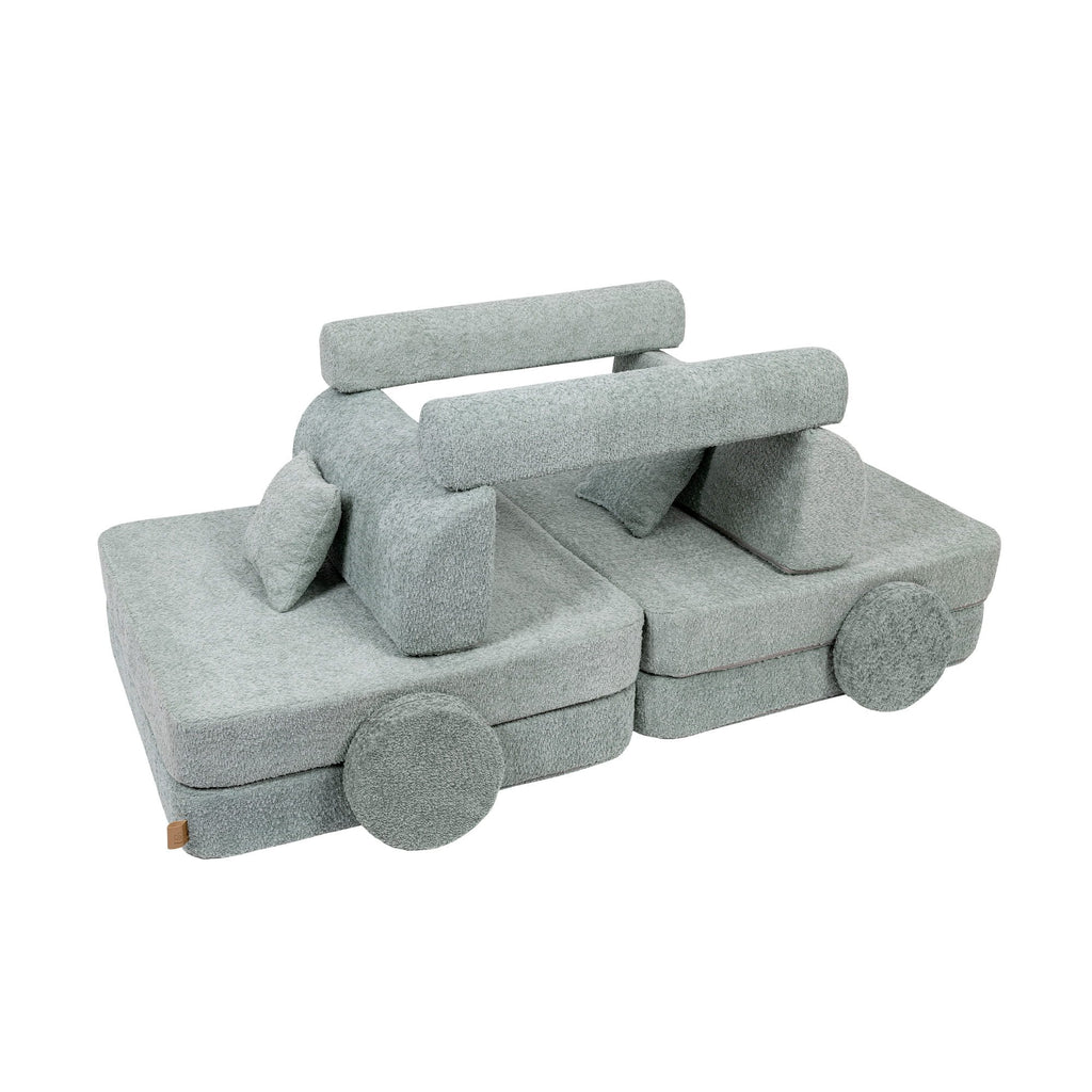 4. Modular children's sofa in fresh mint boucle fabric, arranged into a car shape with cushions, shown in a studio setting