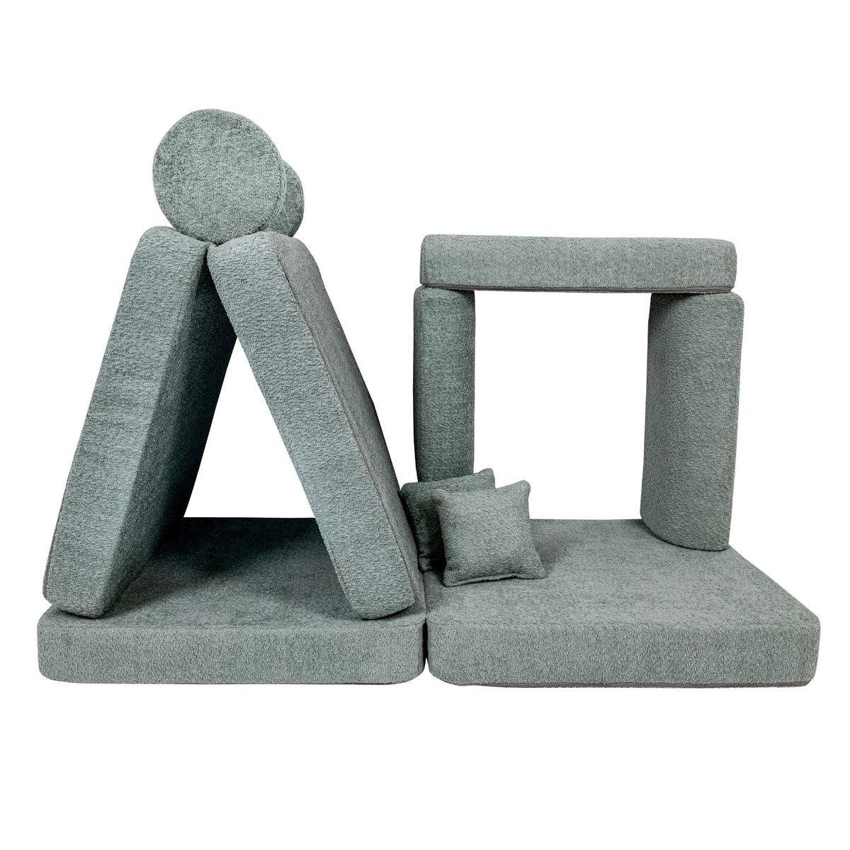 4. Modular children's sofa in fresh mint boucle fabric, arranged into a play structure with cushions, shown in a studio setting