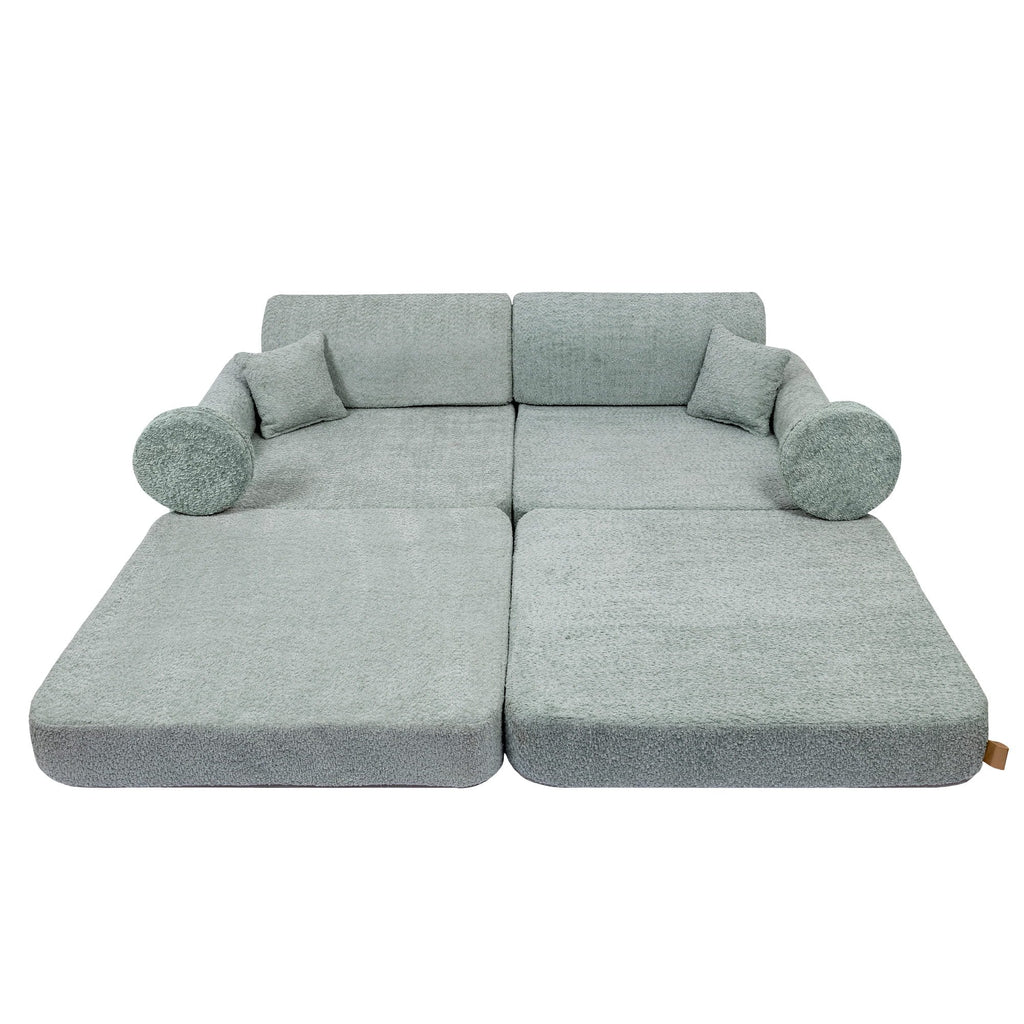 3. Modular children's sofa in fresh mint boucle fabric, fully extended with cushions, shown in a studio setting