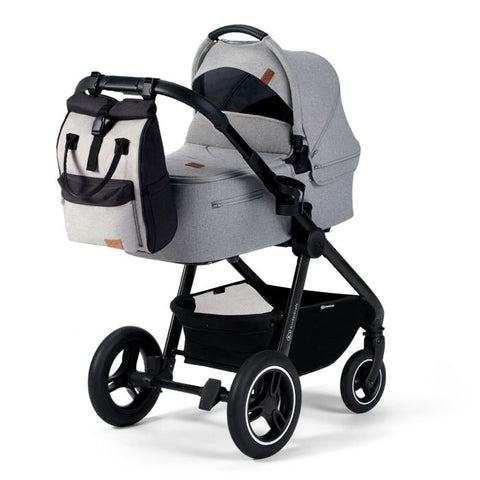 1. Grey Kinderkraft Moonpack diaper backpack attached to stroller in urban setting