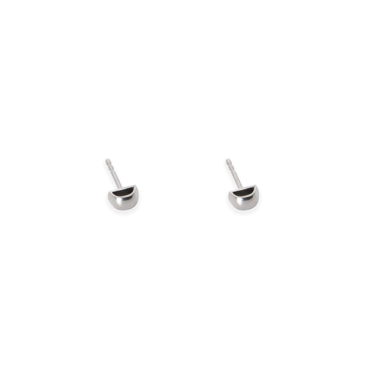 2. Studio image of Maarja Palu HOLLOW small stud earrings in polished silver with minimalist half-circle design