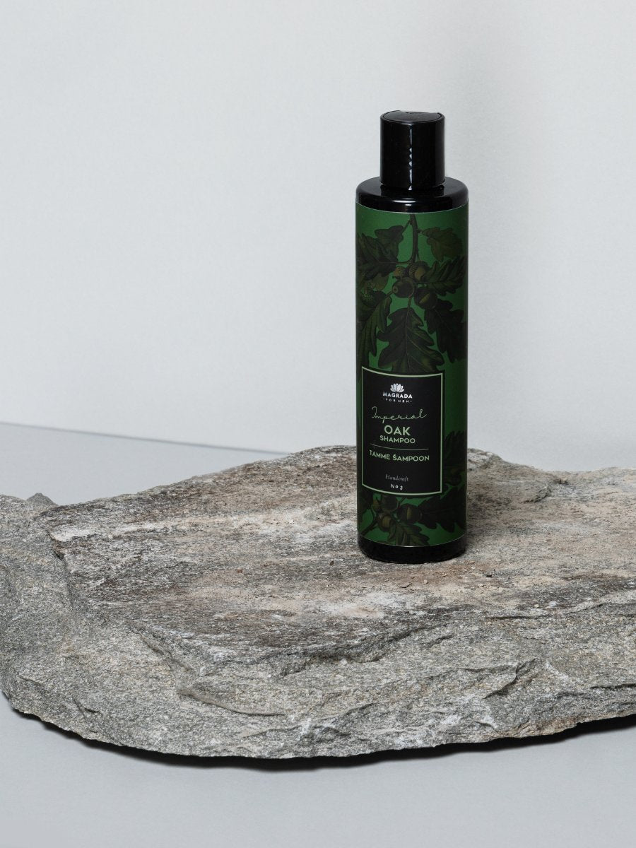 2. Magrada Oak Shampoo 'Imperial' for Men bottle on stone surface, highlighting packaging design