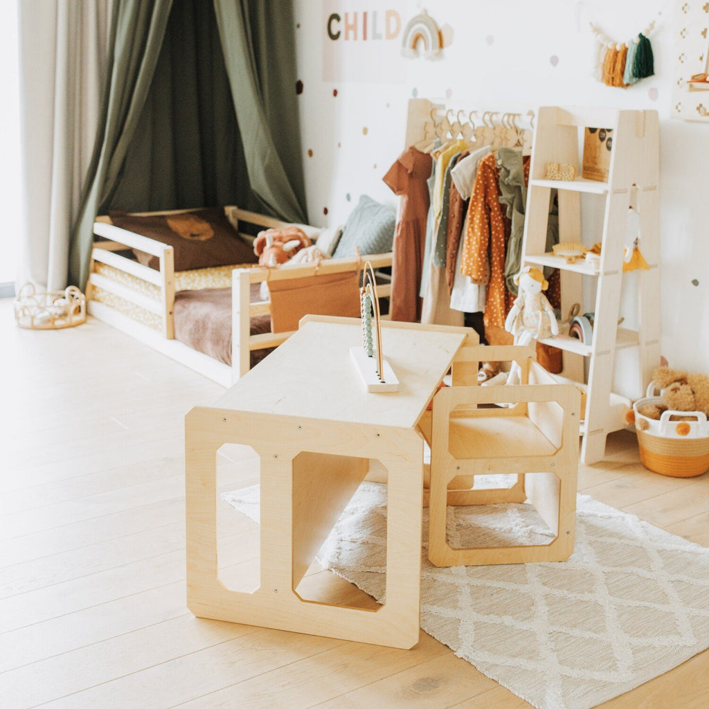 8. Natural wood Montessori table and chair set in a stylish children's room with play area