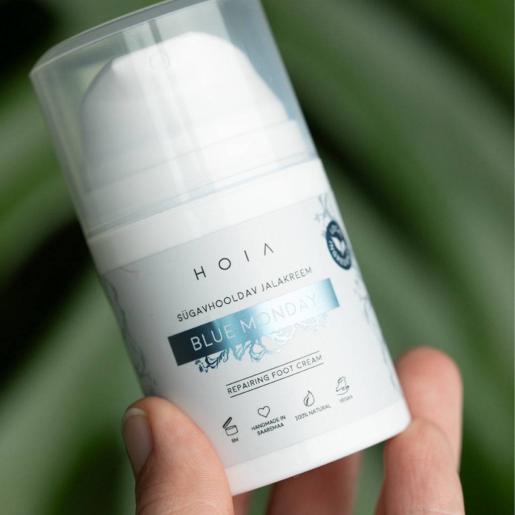 1. HOIA homespa Deep Care Foot Cream BLUE MONDAY, 50ml, held in hand, showcasing packaging design